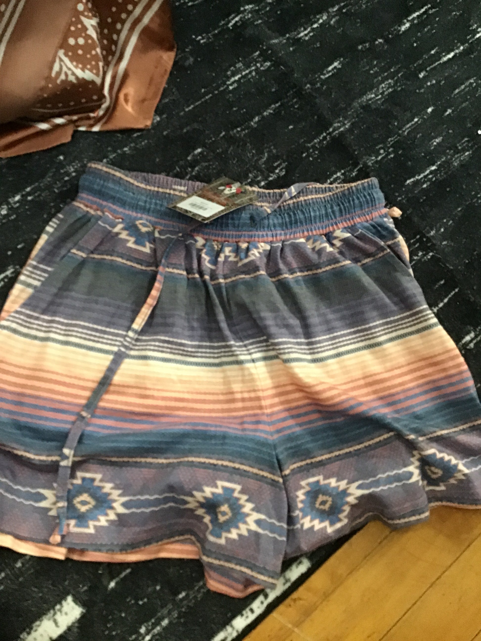 Pink serape shorts.