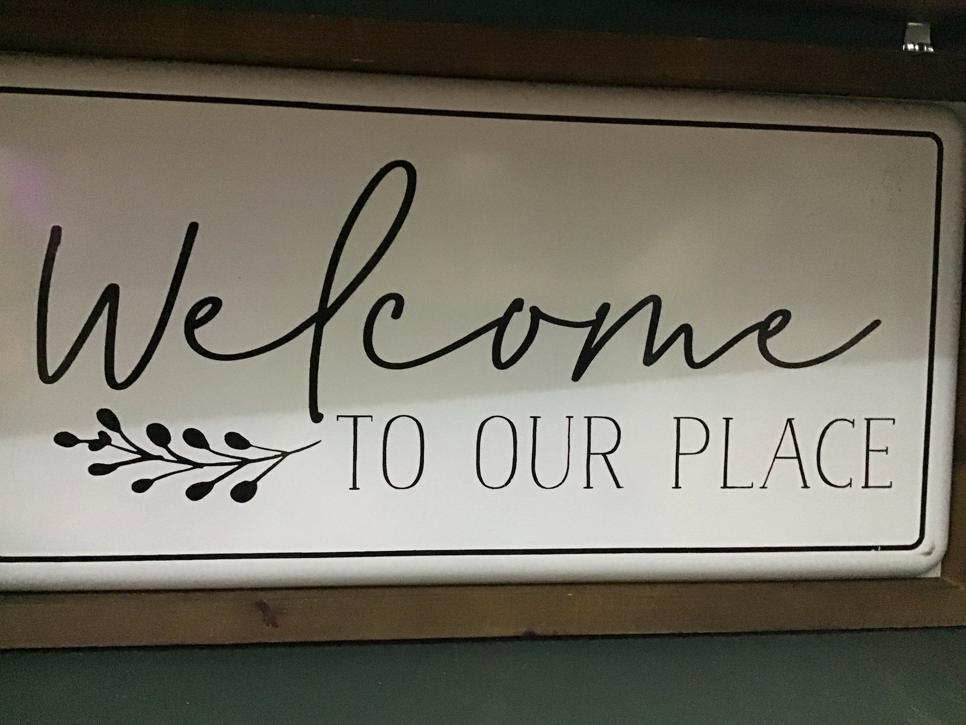Welcome to our place sign