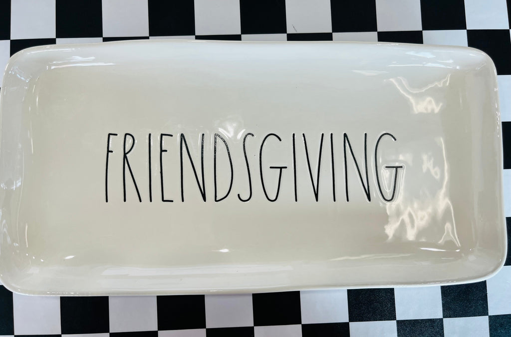 Rectangular white platter with 'FRIENDSGIVING' text on a black and white checkered background