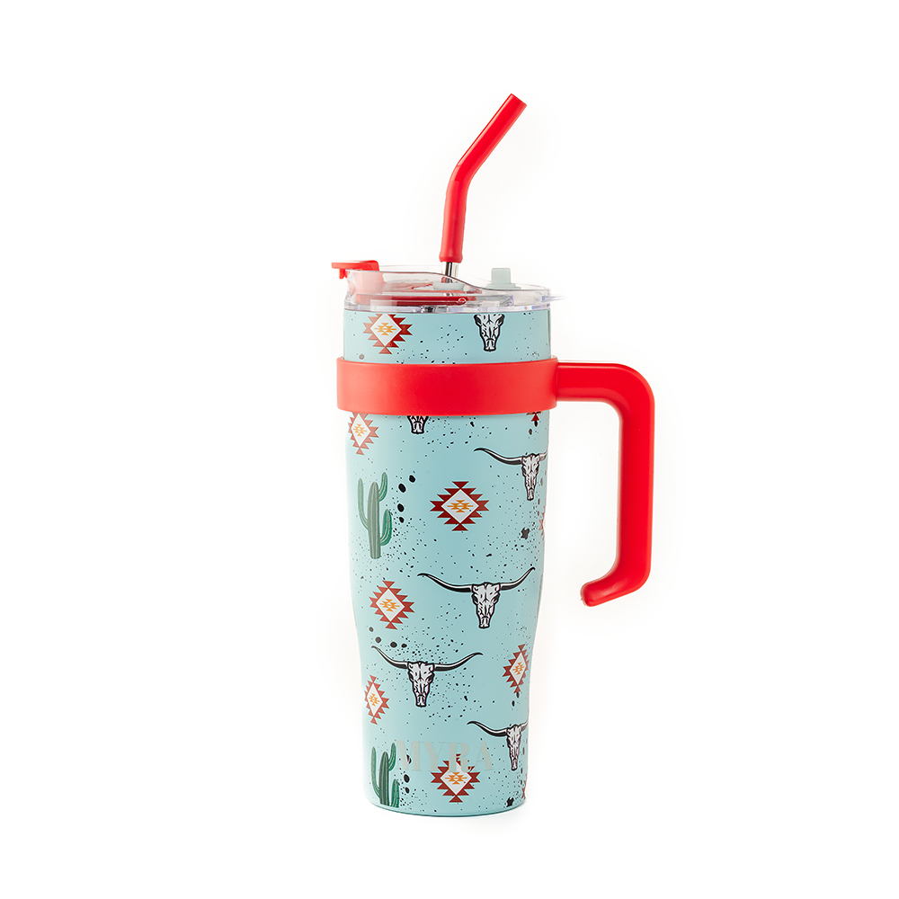 Myra Wide Wyoming Tumbler in sea blue with cowhide print and tooled leather design for everyday use