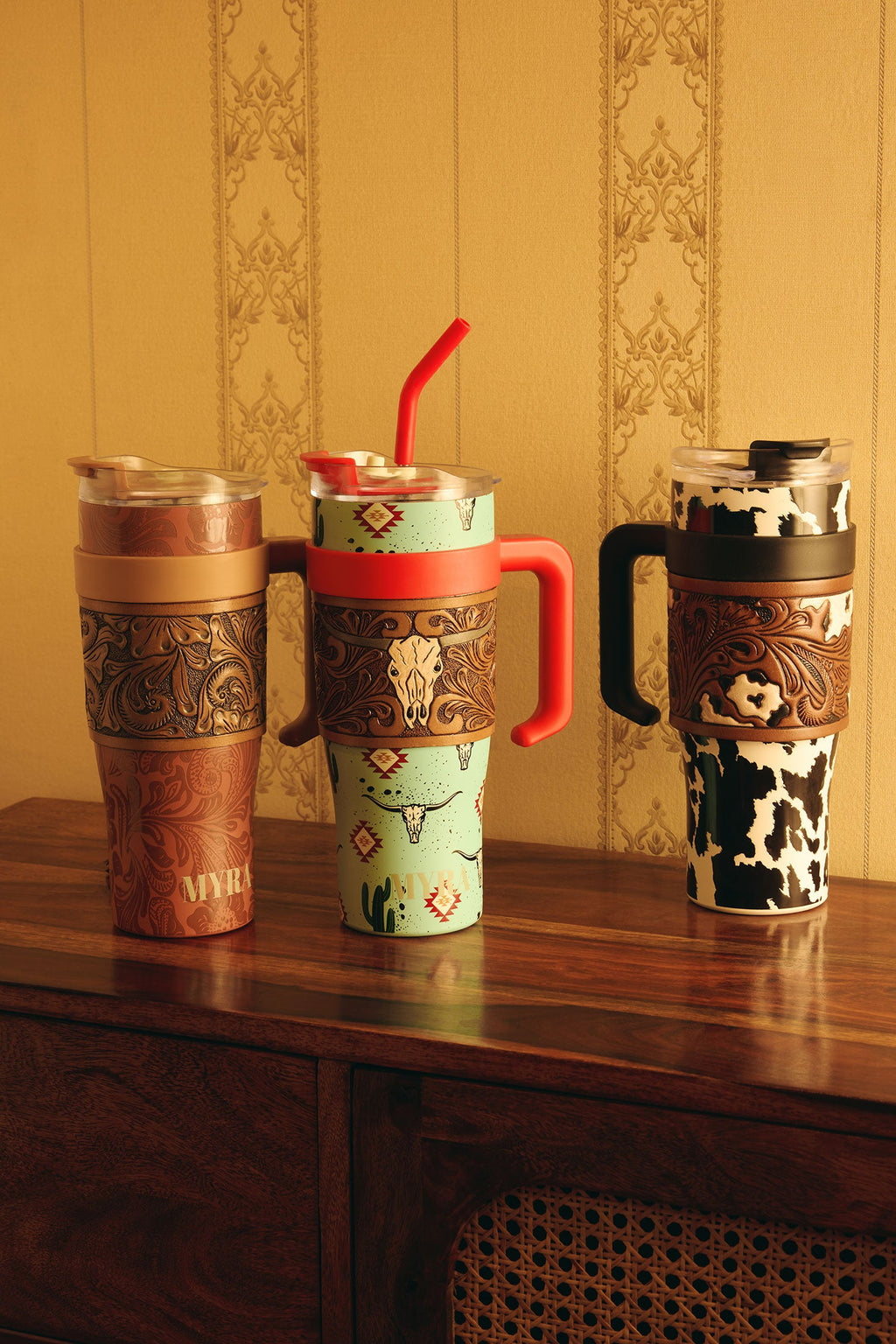 Myra Wide Wyoming Tumbler in sea blue with cowhide print and tooled leather design for everyday use
