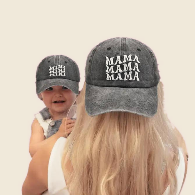 Repeating Mama and Mini Hats worn by mother and baby on a cream background